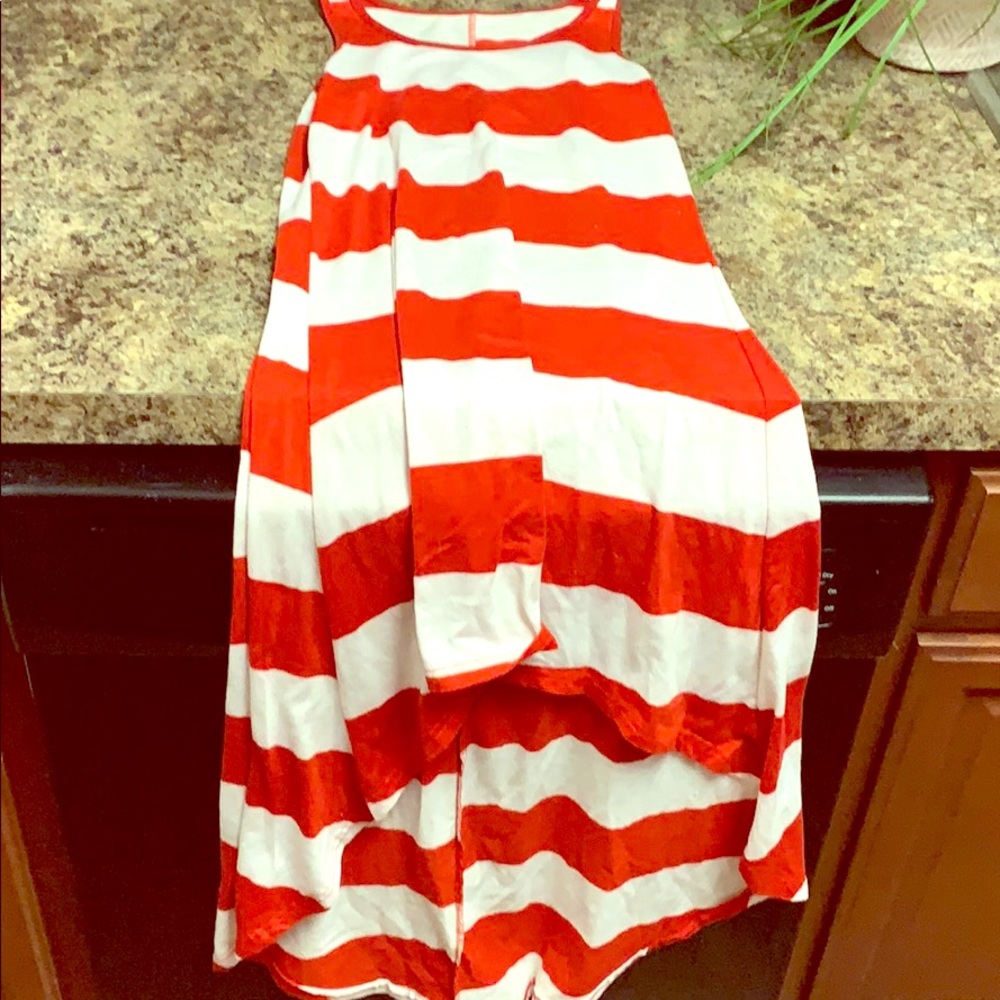 Red and white long in back shirt in front